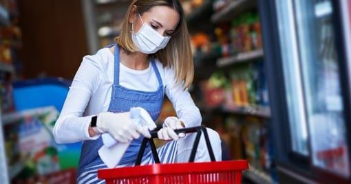 Food Safety - store clerk cleaning shopping basket